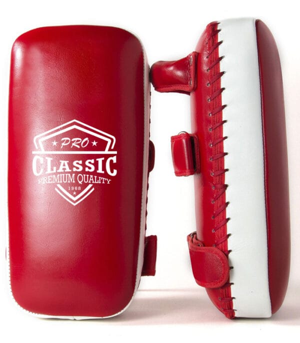 High-quality kicking shields and Thai kick pads manufactured in Pakistan, designed for martial arts, MMA, and Muay Thai training.